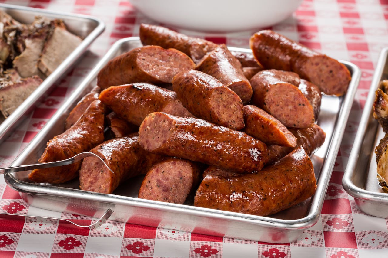 Mouthwatering BBQ sausages served on a metal tray, Austin, Texas.