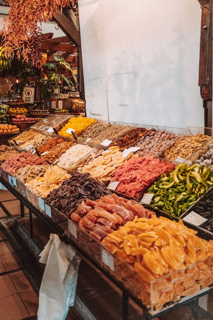 Vibrant array of dried fruits at a local market in Madeira, Portugal.